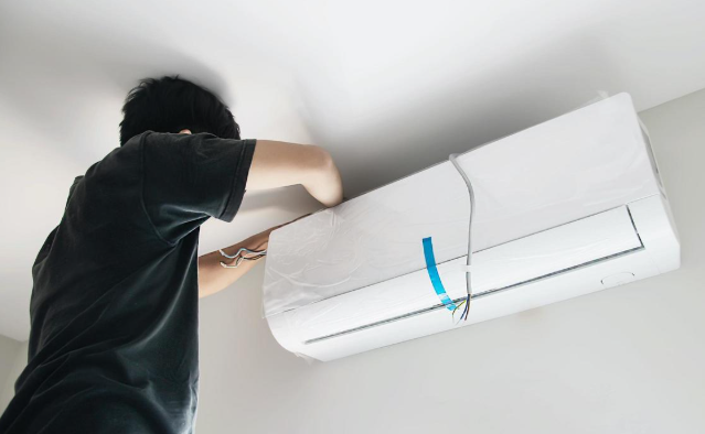 AC installation service in Multan by UrbanFix technician