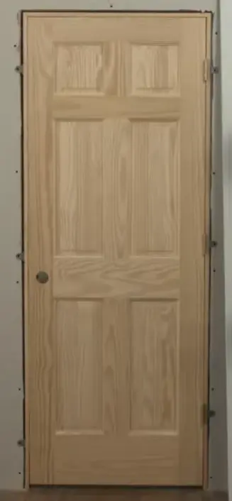 Door installation service by UrbanFix carpenter in Multan